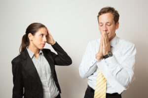 Business dressed male and female in different role plays.