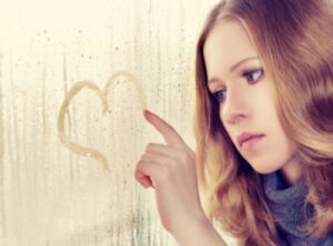 bigstock-Sad-Girl-Draws-A-Heart-On-The--42745087