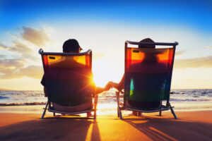 Happy Romantic Couple Enjoying Beautiful Sunset at the Beach