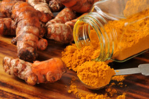 turmeric-roots-and-a-jar-of-turmeric-powder